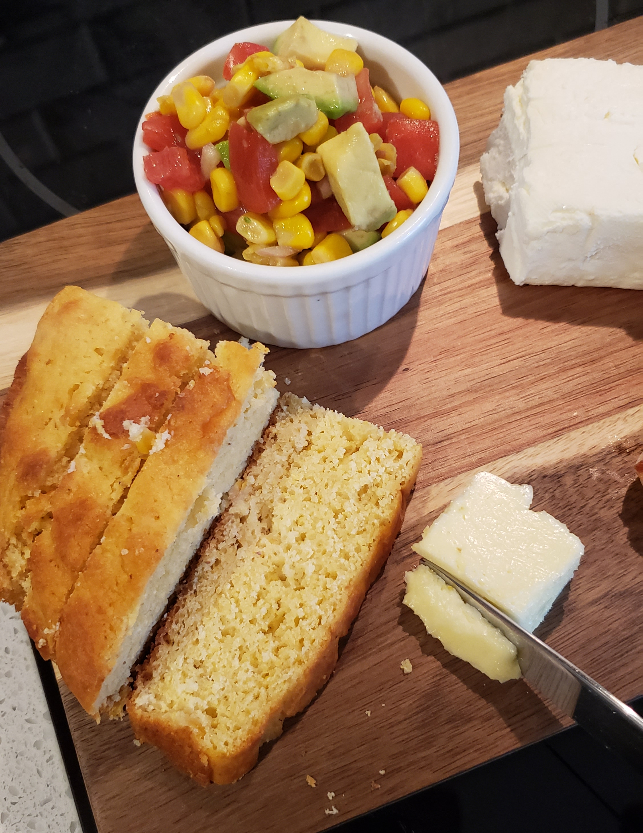 Shows how much butter I spread on each side of the cornbread.